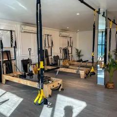 We offer a fully equipped studio with both Pilates reformers and TRX suspension trainers for a comprehensive fitness experience.