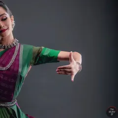 Highlighting the beauty of Mudras, the hand gestures that form the language of Bharatanatyam. The soft studio lighting accentuates the grace and precision of the form.