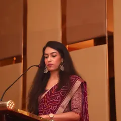 Addressing industry leaders at the Karnataka Facade Forum. Speaking at a podium requires a commanding presence and clear communication, ensuring every word resonates with the audience.
