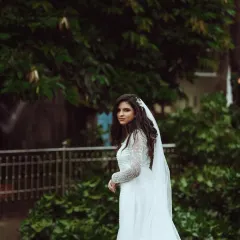 A bride's thoughtful glance back before she steps into her future. My photography team focuses on capturing these poignant, unscripted moments that hold so much emotion.