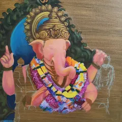 The Ganesha painting in an earlier stage of progress. This view shows how I build layers of color and detail, starting with the central figure and expanding to the ornate background.