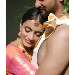 A quiet moment of togetherness. We specialize in capturing the serene and deep connection between a couple, like this tender embrace during a traditional South Indian wedding.