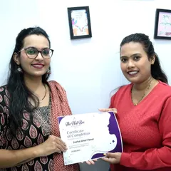 Another proud graduate receiving her certificate of completion. It's a joy to see my students ready to start their professional journey.