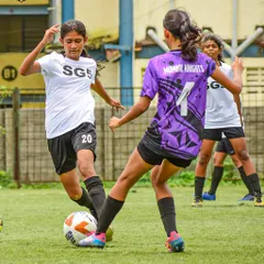 A fierce one on one battle on the pitch. Our girls are trained to be strong in possession and confident in taking on opponents.