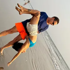Playful moments on the beach with my husband. Trust and support are the foundation of a strong partnership, and sometimes that looks like a literal lift.