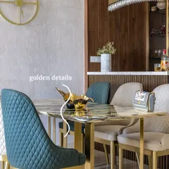 A collection of six unique dining rooms I've designed, showcasing different styles from bold wood tones to breezy coastal vibes. This image highlights a dining space with golden details, a marble-top table, and quilted chairs for a touch of quiet luxury.