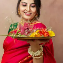 This mother-to-be wanted to incorporate cultural elements into her studio maternity session. Holding a thali of flowers, her gentle smile radiates a sense of peace and celebration.