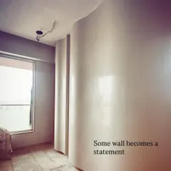 Sometimes a simple wall can become the main statement piece. Here, a curved wall is being finished with a special plaster technique to create a soft, sculptural element that guides you through the space.