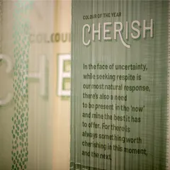 Typography printed on layered, semi-translucent fabric for the 'Cherish' theme. This technique creates a sense of depth and softness, allowing the words to feel like a gentle, integrated part of the material itself.