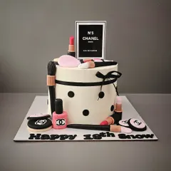 A chic Chanel-themed makeup cake for Snow's 18th birthday. This cake is adorned with edible lipsticks, nail polish, and compacts from her favorite brand.