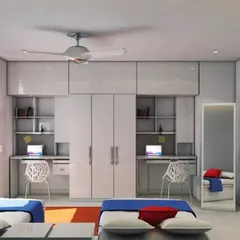 This design for a shared room features two beds with a central wardrobe unit that also houses two individual study desks. The clean, glossy white finish makes the room feel bright and spacious.