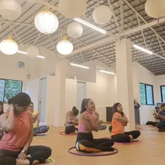A beautiful moment of connection and self-hug during a yoga session at a retreat. My workshops aren't just about the hoop, they're about self-care and being kind to our bodies.