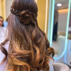 A hairstyle that's pure art. We created this beautiful look by combining a soft balayage for dimension with an intricate rose braid, perfect for a special occasion or when you just want to feel amazing.