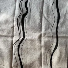 A close-up view of the hand-painted wavy line print. You can see the texture of the fabric and the subtle variations in the lines, which is the beauty of a handcrafted textile.