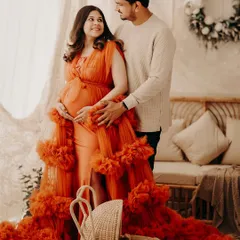 An intimate portrait from our boho-themed set. The warm lighting and rustic decor provide a cozy backdrop for capturing the loving gaze between partners.