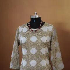 This elegant long kurta features a beautiful gold and white block print. It's a sophisticated piece that can be worn for a casual day at work or a small family gathering.