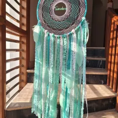 Dreamcatcher magic in Teal Green. Handcrafted with our brand name 'Twinvibes' woven in, this piece is a symbol of protection and positivity, bringing serenity to your space.