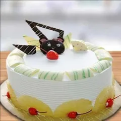 A cute and fun cake for all ages, this design features a chocolate bear face on top of a delicious pineapple cake. It's a great way to add a playful touch to any birthday celebration.