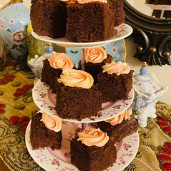 My super moist chocolate cake squares are topped with pretty dual-toned rosettes. They look beautiful arranged on a tiered stand for a high tea party.
