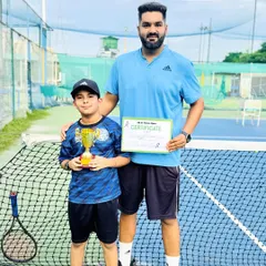 Here is one of our youngest champions, Aabaan Sachdeva, after winning the Under-10 singles title at just 8.5 years old. Our beginner's program focuses on building strong fundamentals and a love for the game, setting the stage for future success on the court.