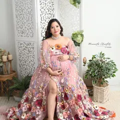 Blooming with life. This unique portrait features a beautiful gown adorned with colorful flowers, creating a vibrant and joyful image in my bright studio setup.