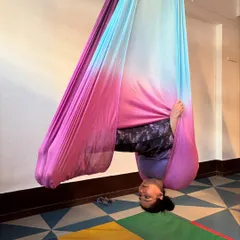 Look at that smile. This is what it feels like to trust the hammock and see the world from a new perspective. This supported inversion helps decompress the spine and feels absolutely wonderful.