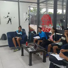 Our players in a classroom session, focusing on the mental aspects of the game. We believe that understanding strategy and psychology off the court leads to better performance on it.
