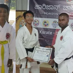 Six years of hard work paying off. This moment, awarding a black belt, represents a long journey of commitment, perseverance, and mastery of the art.
