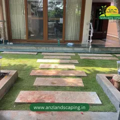 Looking back towards the house, this view shows the clean lines of the pathway and how the new lawn enhances the home's entrance.