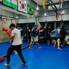 The energy in our group classes is unmatched. Here, the evening batch is working on their striking, pushing each other to get stronger together.