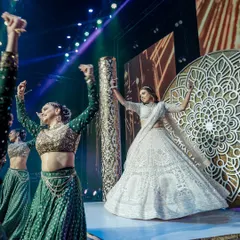 This bride was determined to give a show-stopper surprise performance for her groom. After several dedicated practice sessions, she absolutely nailed her solo, complete with professional backup dancers and a stunning stage setup.