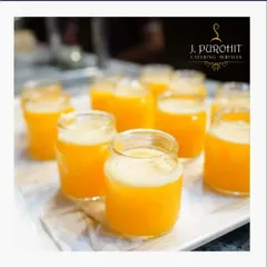 Nothing beats the taste of real fruit. My fresh juice station offers options like these vibrant orange juice shots, squeezed on-site to guarantee maximum freshness and flavor. They serve as a perfect, healthy welcome drink or a refreshing palate cleanser during any event.