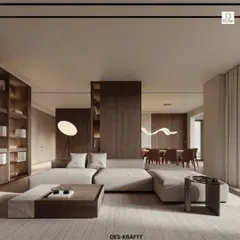 This open-plan living space embodies the principles of warm minimalism. We combined a low-profile modular sofa with rich walnut wood paneling and integrated shelving to create a home that feels expansive, organized, and deeply calming.