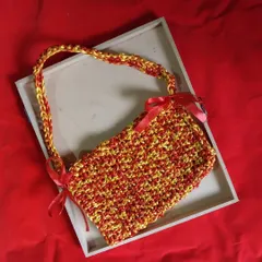 This vibrant red and yellow crochet bag with satin bow details is a perfect example of a custom creation. I love bringing your colorful ideas to life with yarn.