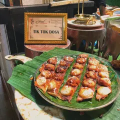 The Tik Tok Dosa is one of my most requested live counter items. These bite-sized dosas are made fresh and served hot, offering a unique culinary experience for your guests.