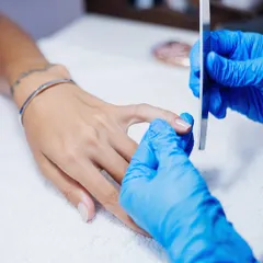 Precision in every movement. We expertly shape each nail with a file, creating the perfect canvas for your manicure.