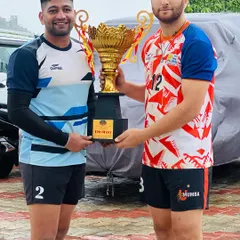 Academy players Irfan Mir and a teammate proudly display the winner's trophy from a major tournament in Himachal, which came with a prize of 51,000.
