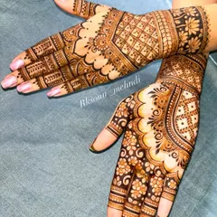 A beautiful and clean bridal design featuring geometric check patterns and delicate floral work. The symmetrical layout on both hands creates a look of perfect harmony and elegance.