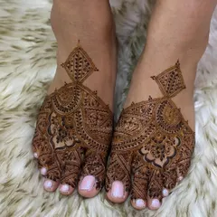 A unique and modern foot mehendi design that creates a bold statement with its geometric and floral patterns.