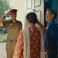 This heartwarming homecoming scene required styling that felt genuine for the whole family. I dressed the parents in simple, comfortable clothes to emphasize the emotional reality of the moment when their daughter, a newly commissioned officer, returns home.