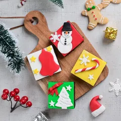 Our Christmas treat boxes are filled with delightful goodies like these decorated brownies. They make a perfect last-minute gift or a sweet addition to your holiday spread.