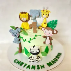 It's going to be a wild first birthday. This vanilla safari-themed cake is adorned with adorable, handmade fondant animals like a lion, elephant, and monkey.