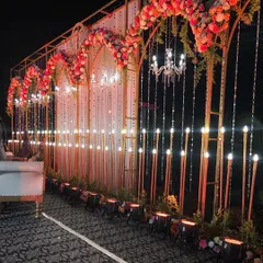A closer look at the Lonavala reception stage reveals the intricate details. We combined warm lighting, hanging crystal strings, and dense floral arrangements to create a backdrop that is both luxurious and inviting.