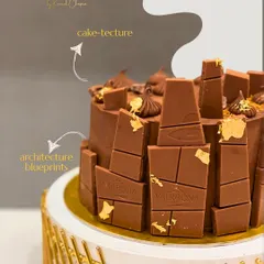 I call this "cake-tecture". Designed for an architect, this rich Valrhona chocolate cake is structured to resemble architectural blueprints. It’s a perfect example of how I translate your passions and stories into a delicious, edible art form.