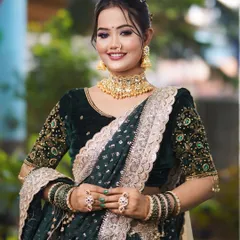 A full-length view of the festive green saree look. The makeup is designed to be bold and beautiful, ensuring you stand out at any event.