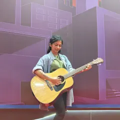 Cosplaying as Ellie from the game 'The Last of Us' at Comic-Con Bengaluru. I love blending my passion for music with other interests, like this impromptu guitar moment.