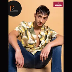A seated pose from the male model shoot, highlighting the natural-looking skin finish achieved through our techniques.