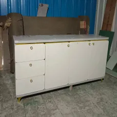 The same console table after shutter installation in the factory. The final step is finishing and hardware before it's ready for delivery.