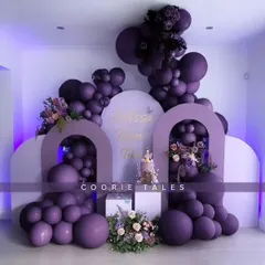 A touch of royalty with a modern, monochromatic design. This stunning setup uses various shades of deep purple for the balloons and backdrops, creating a sophisticated and dramatic look for a special celebration.