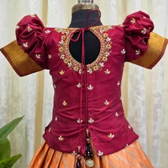 The back of this blouse is just as beautiful as the front. It features a keyhole opening and is surrounded by delicate maggam embroidery.